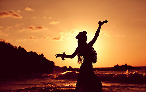 hula dancer in sunset on beach