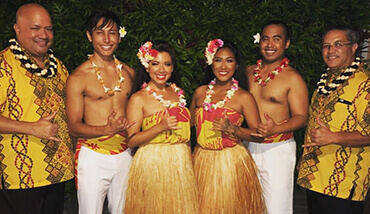 tahitian dancers in traditional costumes with headpeice