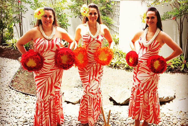 female hula dancers in traditional costume